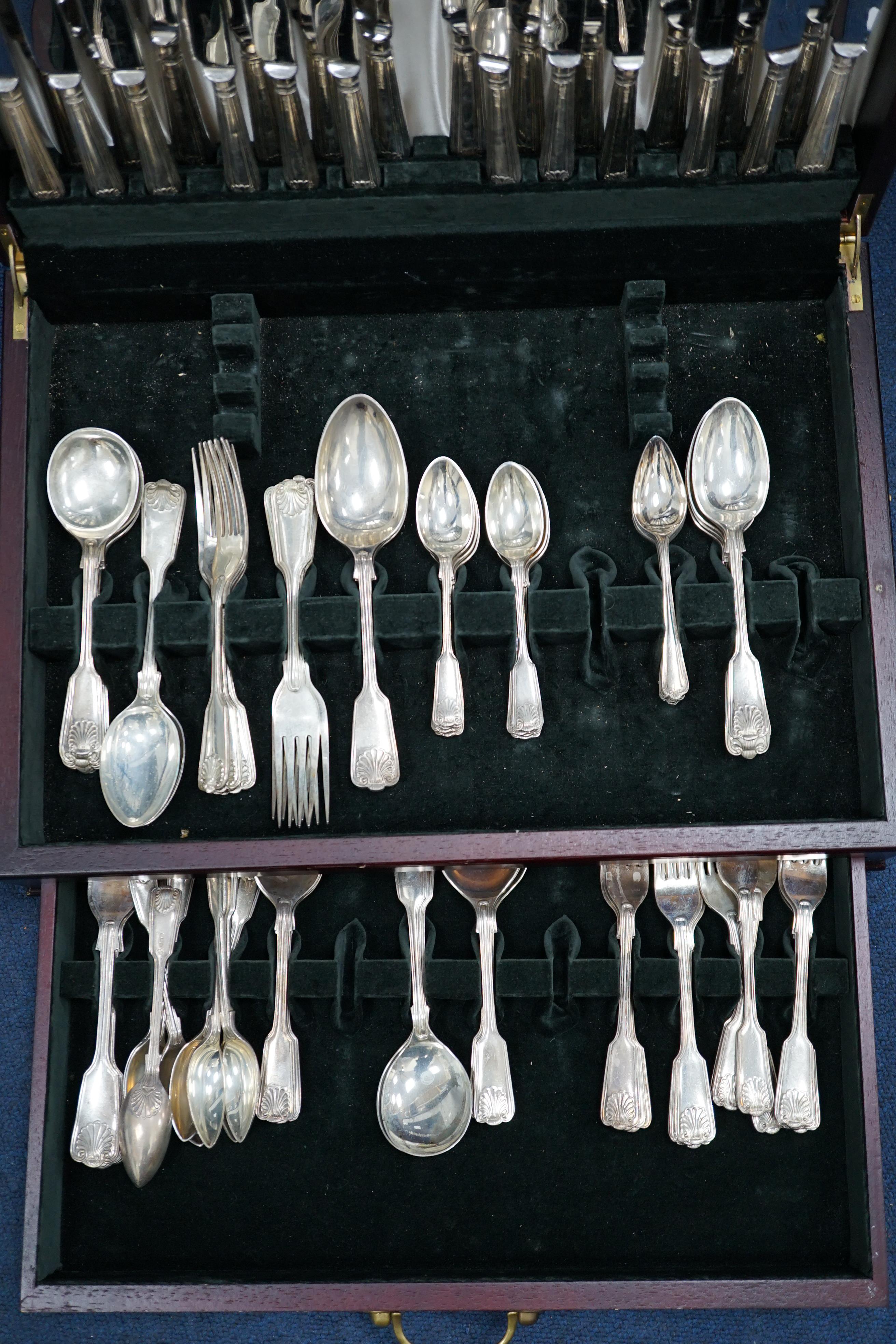 A matched part canteen of modern silver fiddle, thread and shell pattern cutlery, by Roberts & Belk and Cooper Brothers & Sons